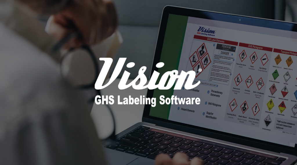 Person viewing laptop showing GHS chemical labels and symbols with overlay text Vision GHS Labeling Software.