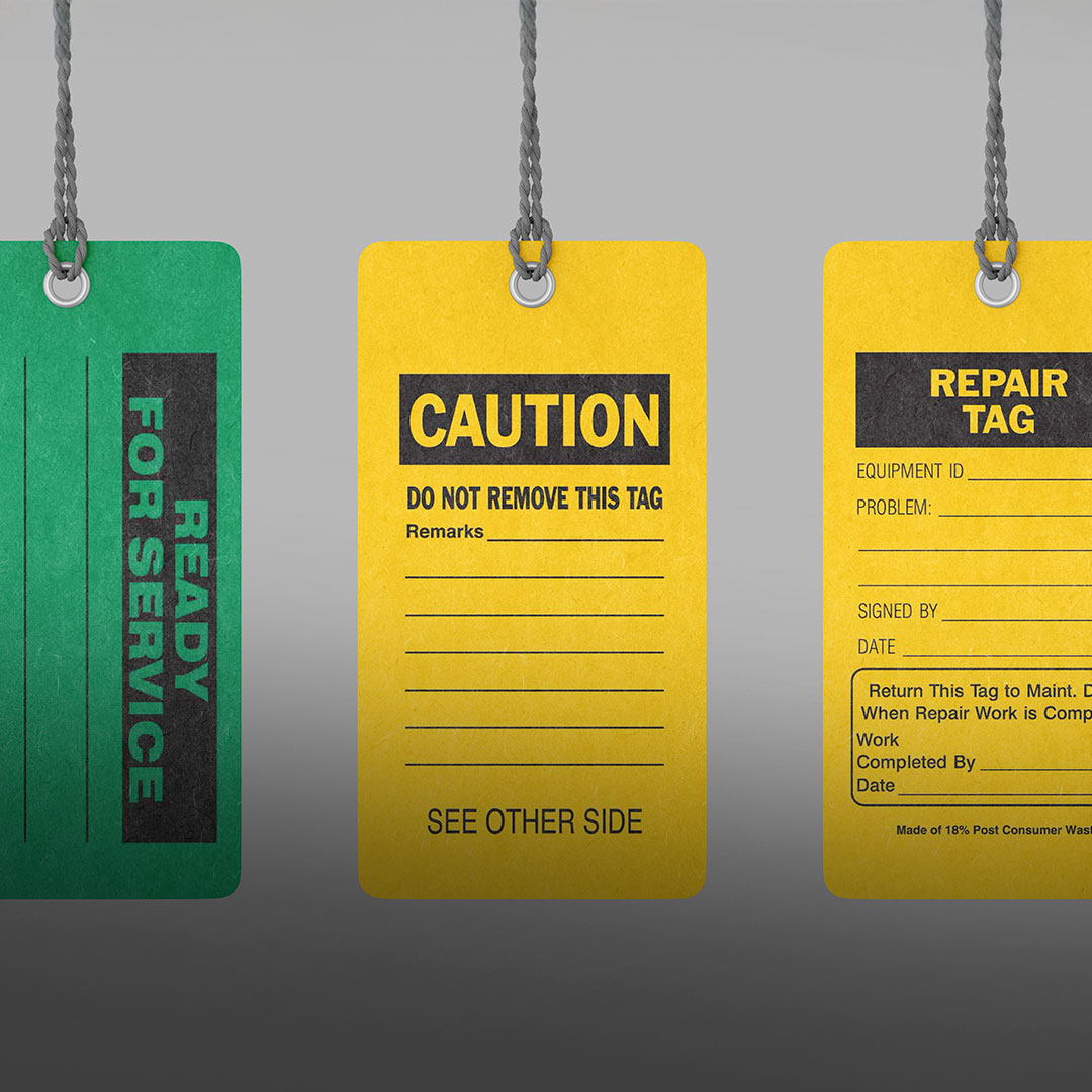 Three hanging tags: green Ready For Service, yellow Caution with blanks, and yellow Repair Tag for equipment ID, problem, and details.