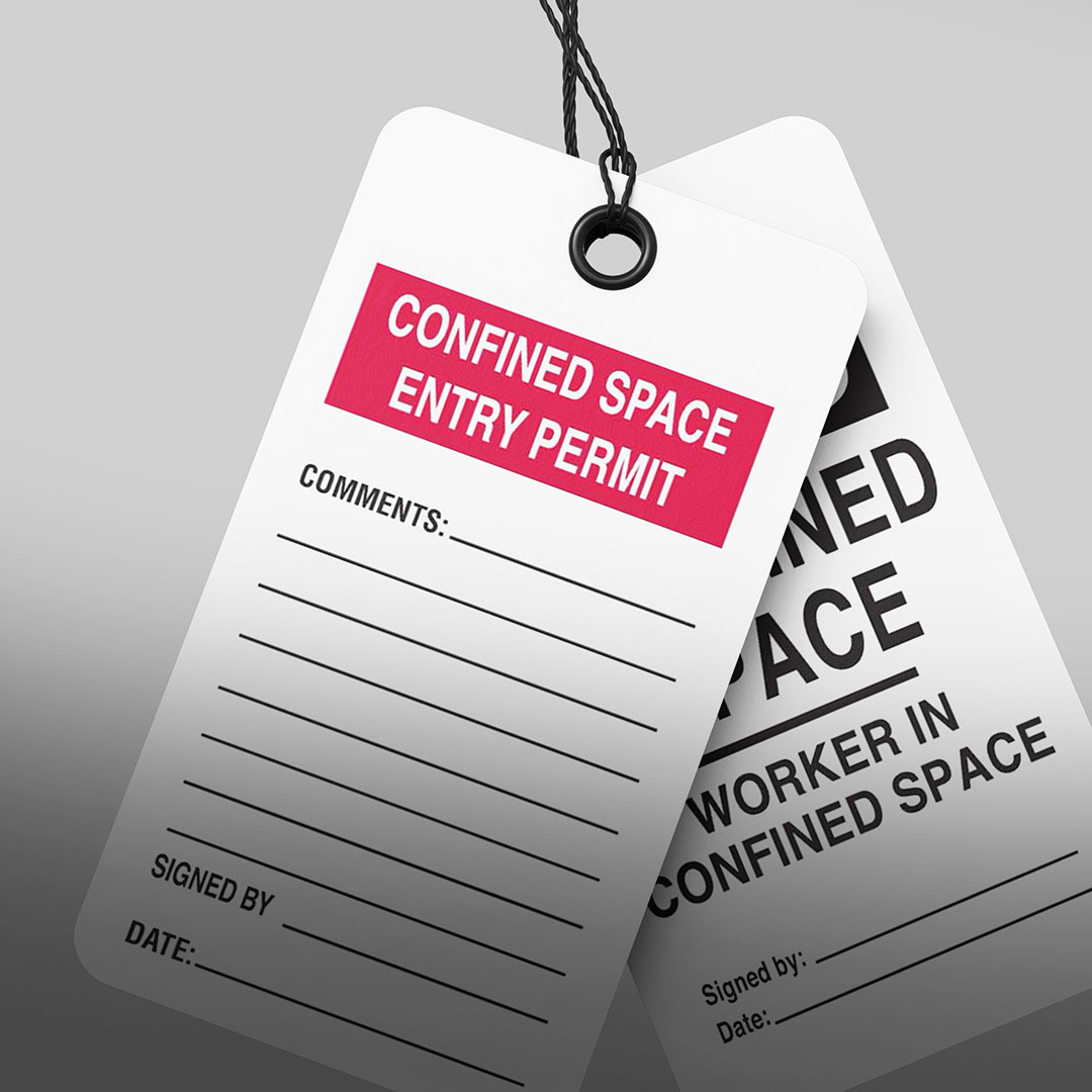Two hanging Confined Space Entry Permit tags with fields for comments, signature, and date; one is fully visible, one partly hidden.