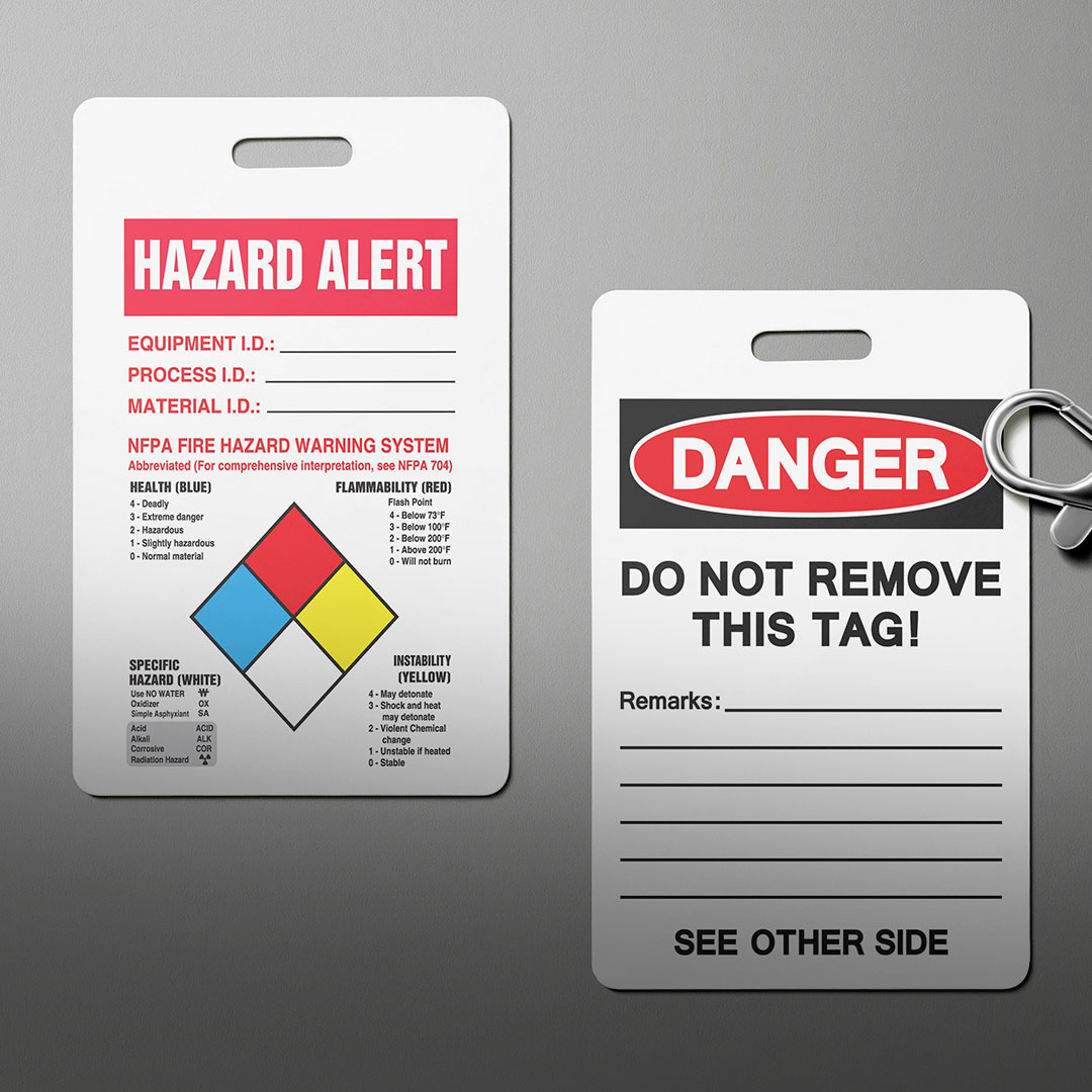 Two safety tags: one with hazard info and NFPA diamond; the other with Danger Do Not Remove warning, remarks lines, See Other Side.
