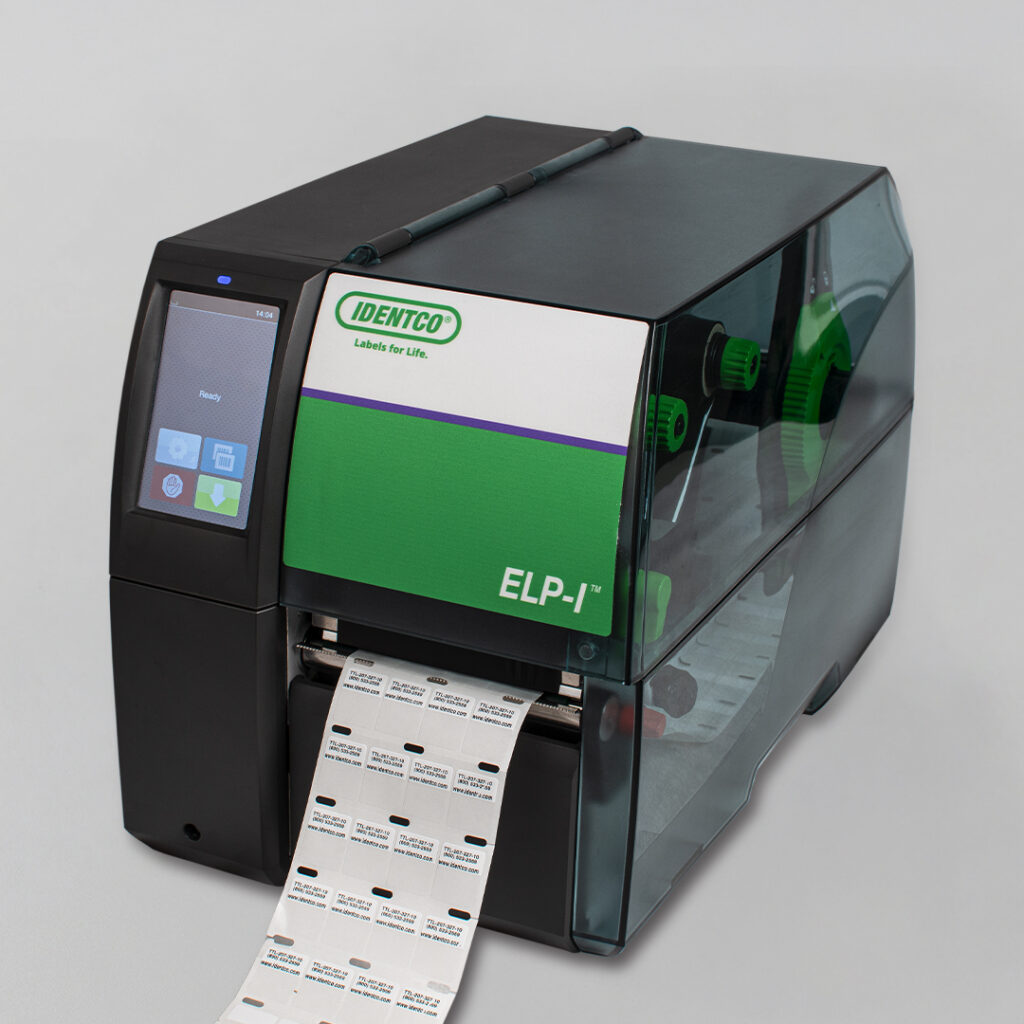 Label printer with touchscreen displaying labels, Identco green and white logo, ELP-I text on front, transparent sides reveal mechanisms.