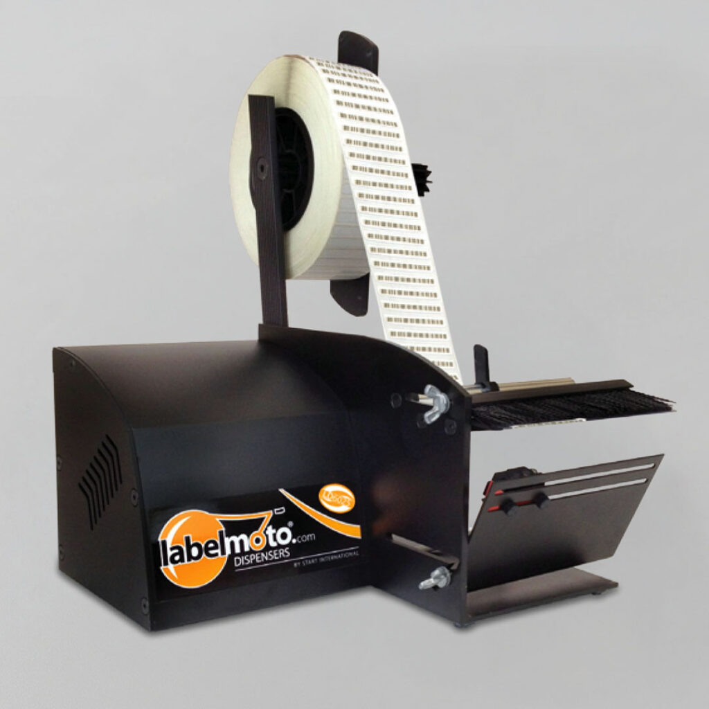 Black Labelmoto label dispenser with a loaded roll of white adhesive labels, set against a plain gray background.