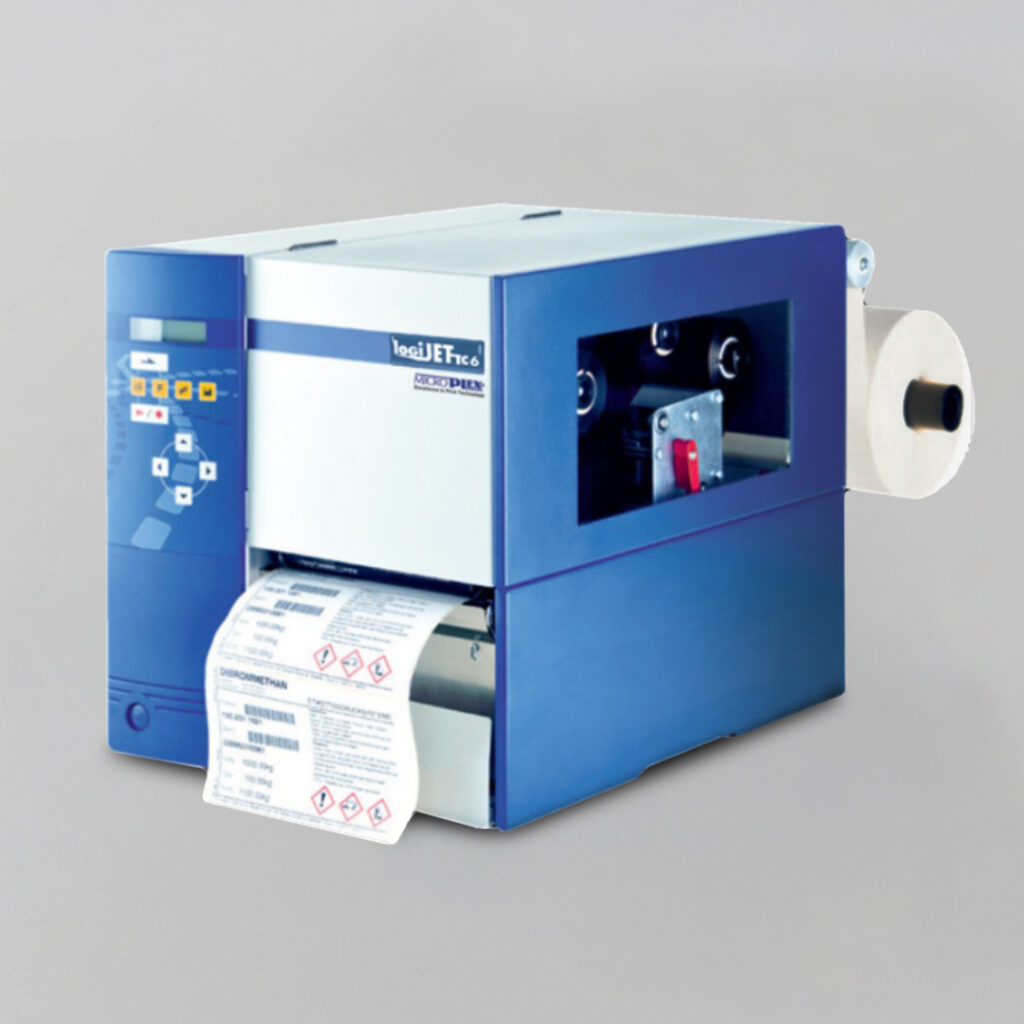 Blue and white industrial label printer with control buttons and display panel, printing chemical hazard labels from a side-mounted roll.