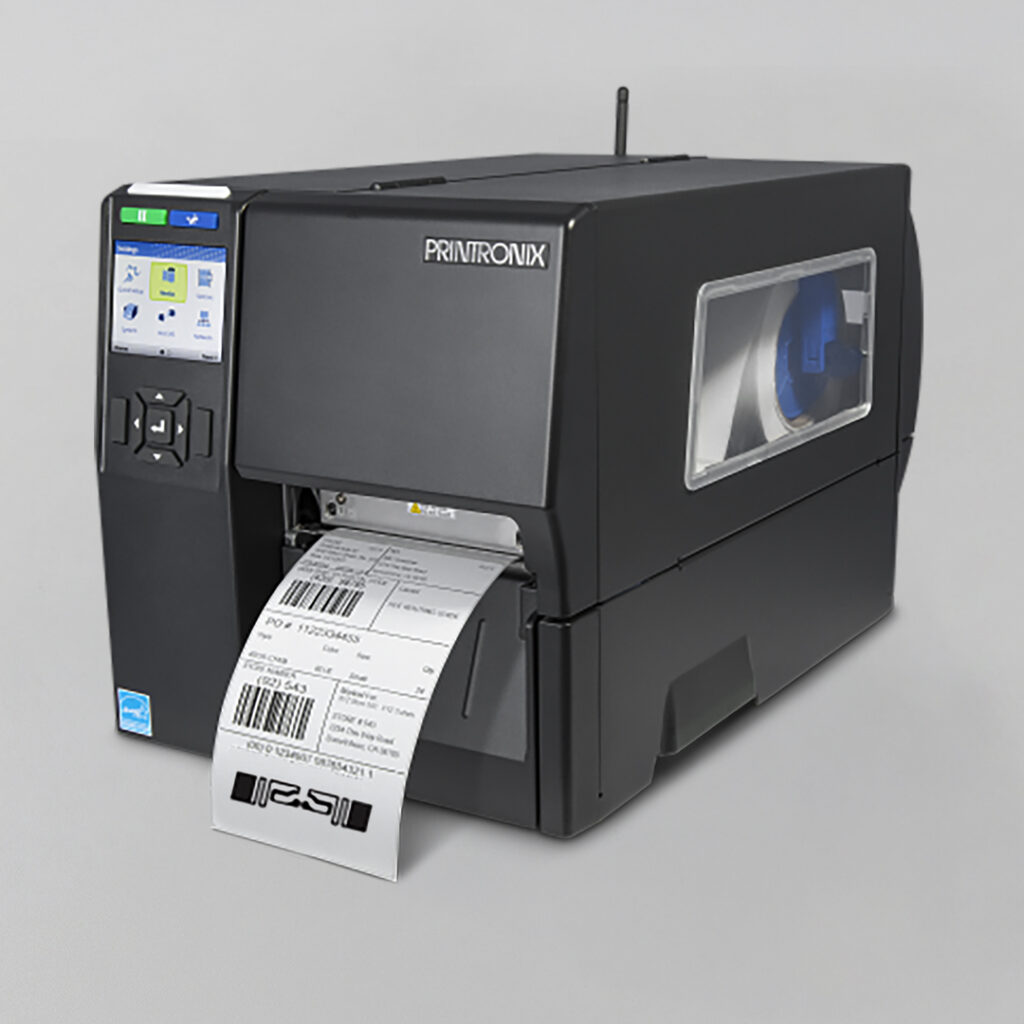 Black Printronix label printer printing a shipping label, with display and buttons on the left and label roll visible through side window.
