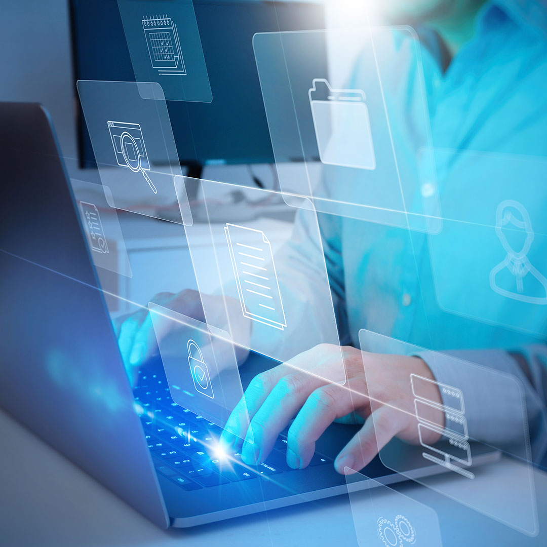 A person types on a laptop keyboard with transparent digital icons, such as folders, documents, and locks, floating above the keyboard, symbolizing digital file management and cybersecurity.