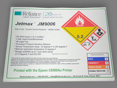 Reliance Jetmax JM9006 label with chemical hazard symbols, fire and health warnings, storage guidelines, chart, and company logo.