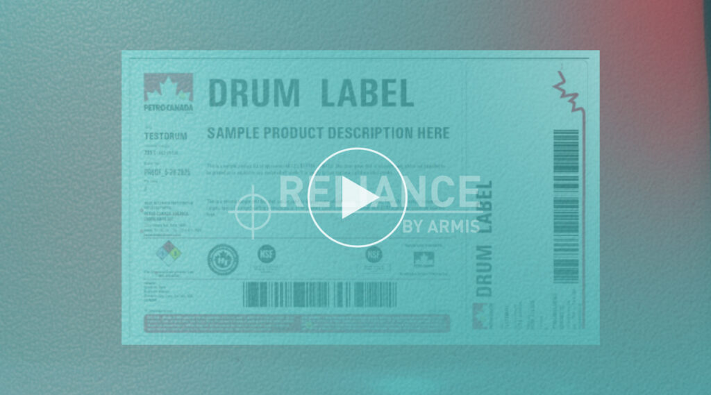 Petro-Canada drum label with product info, barcodes, hazard and certification icons, play button, RELIANCE BY ARMIS text.