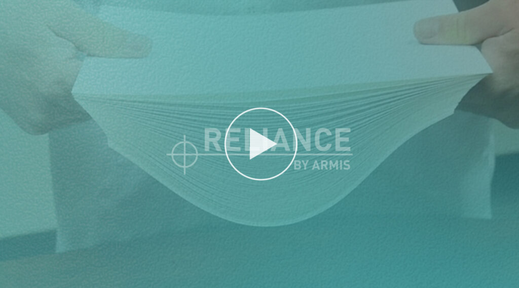 Person bending a thick stack of white paper, with RELIANCE BY ARMIS text and a play button icon overlayed at the center.