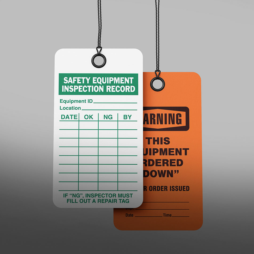 White and green Safety Equipment Inspection Record tag with fields for inspection; orange Warning tag marking equipment ordered down.