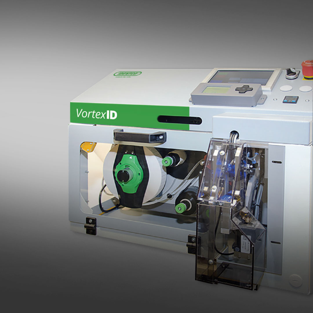 VortexID industrial machine with control panel, buttons, display screen, and exposed rollers against a gray gradient background.
