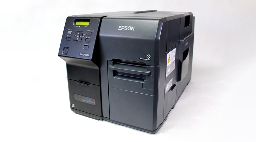 Black Epson industrial label printer with front control buttons and display screen on a plain white background.