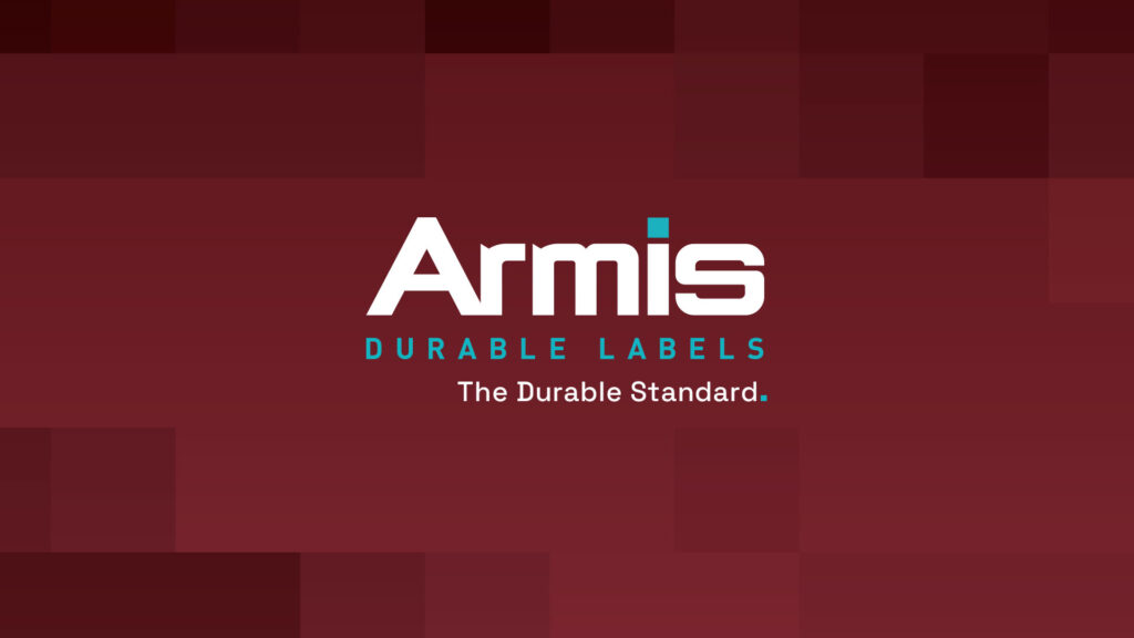 Armis DURABLE LABELS logo on red pixelated background with blue subtitle and tagline The Durable Standard in white bold letters.