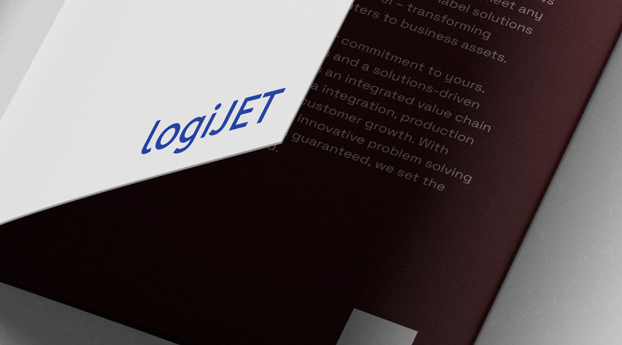 Close-up of a partially open brochure featuring logiJET in blue text on white, with blurred white text on dark maroon background below.